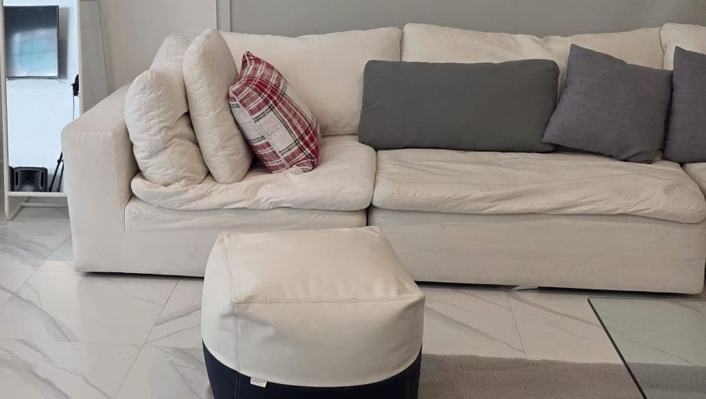 A Florida living room after a thorough cleaning, cushions squared and floors gleaming